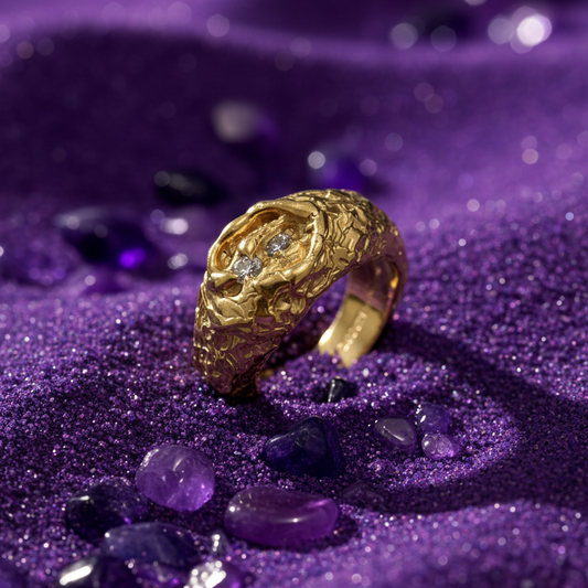 Gold ring with a diamond on a purple glittery background